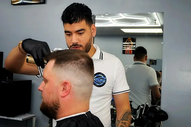 Barber blending a fade